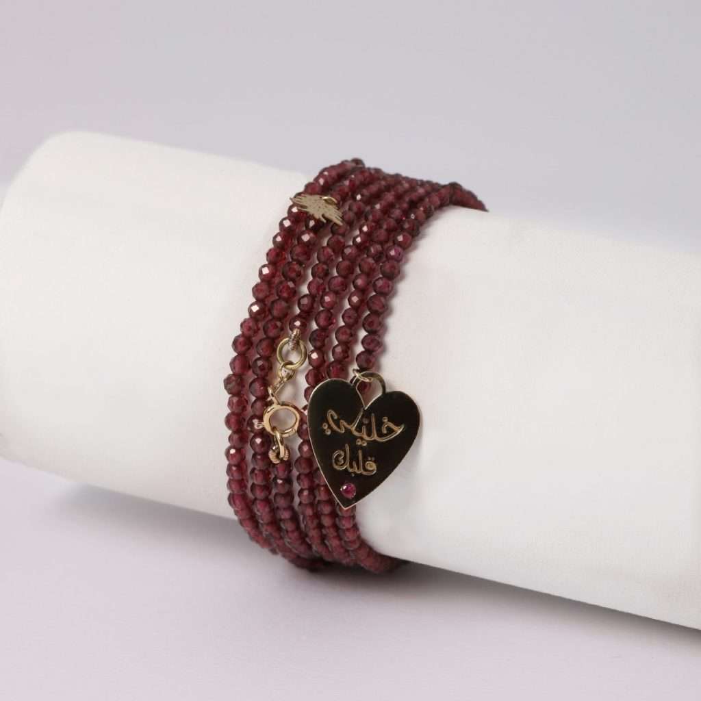 18K YELLOW GOLD EHDEN BRACELET WITH HEART SHAPE KHALILE ALBAK, RUBY AND GARNET STONE