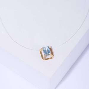 18K YELLOW GOLD  CHOCKER WITH BLUE TOPAZ STONE ON TRANSPARENT CORDON
