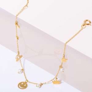 18K YELLOW  GOLD BRACELET WITH MINI CHARMS AND PEARL