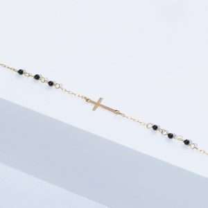 18K YELLOW GOLD CROSS BRACELET WITH ONYX STONE