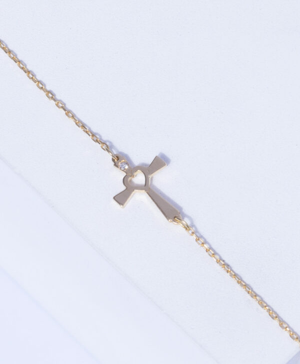 18K YELLOW GOLD CROSS BRACELET WITH WHITE DIAMOND